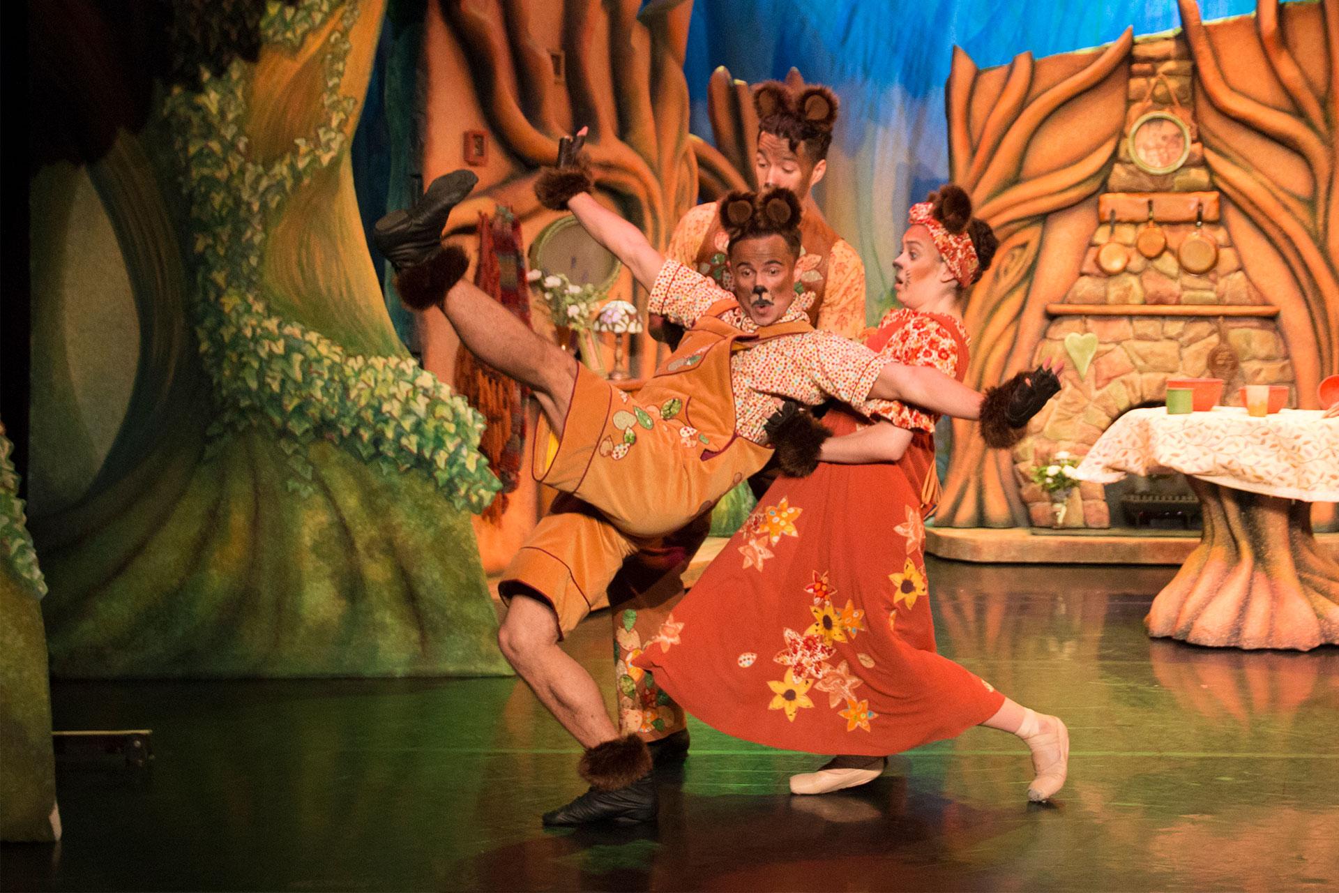 Goldilocks & the Three Bears, production, 2016, Gavin McCaig as Baby Bear and Darragh Hourrides as Mama Bear, photo Lauren Godfrey Mama and Papa Bear help Baby Baby back up after he falls