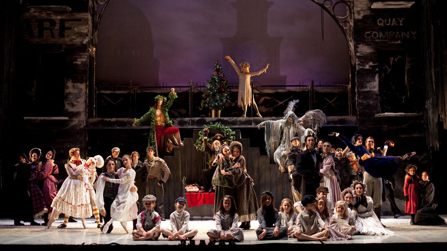The full cast of A Christmas Carol gather on stage in the finalé