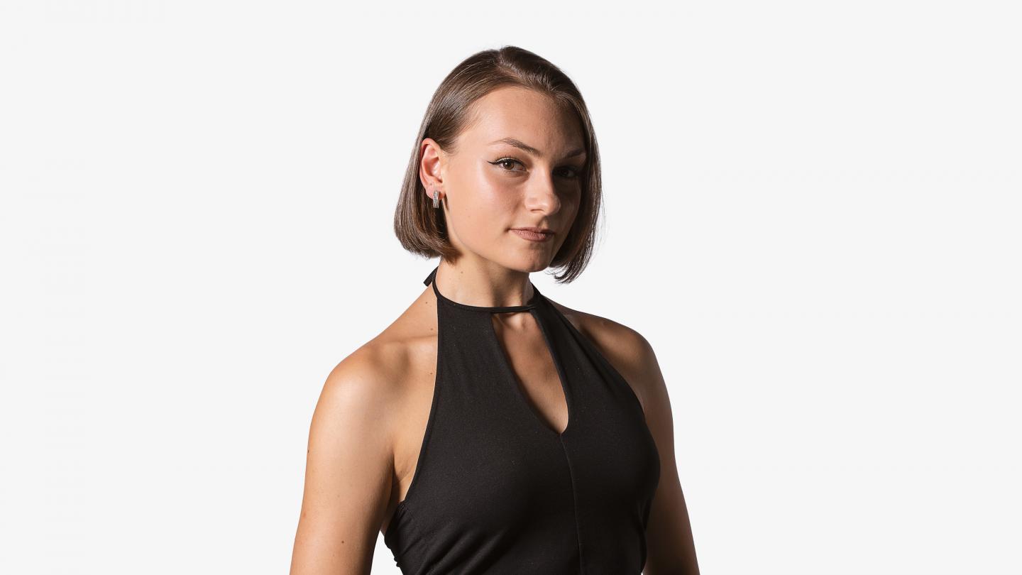 Headshot of a female dancer in a black top