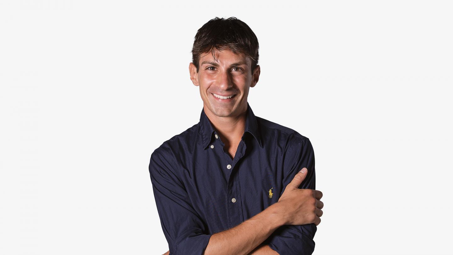 Headshot of a male dancer in a navy shirt