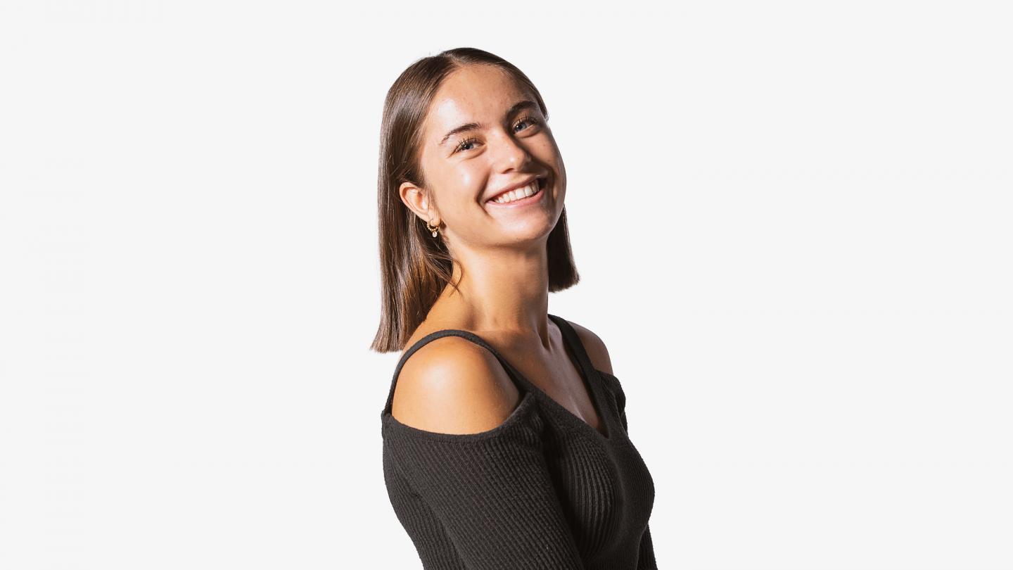 Headshot of a female dancer in a black top