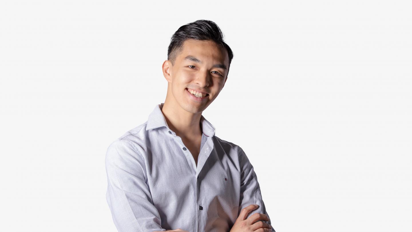 Male dancer headshot in light blue shirt