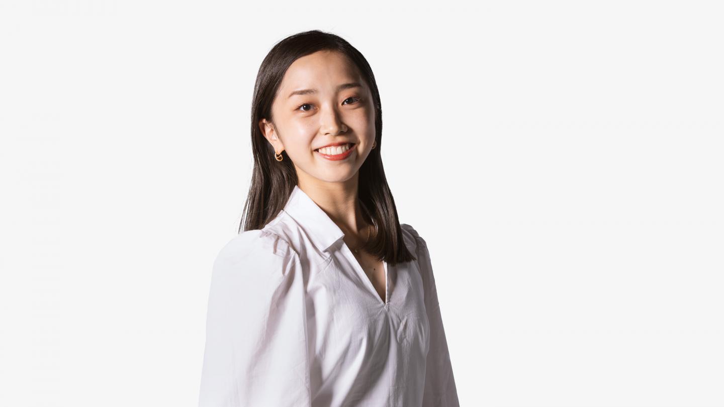 Headshot of a female dancer in a white shirt