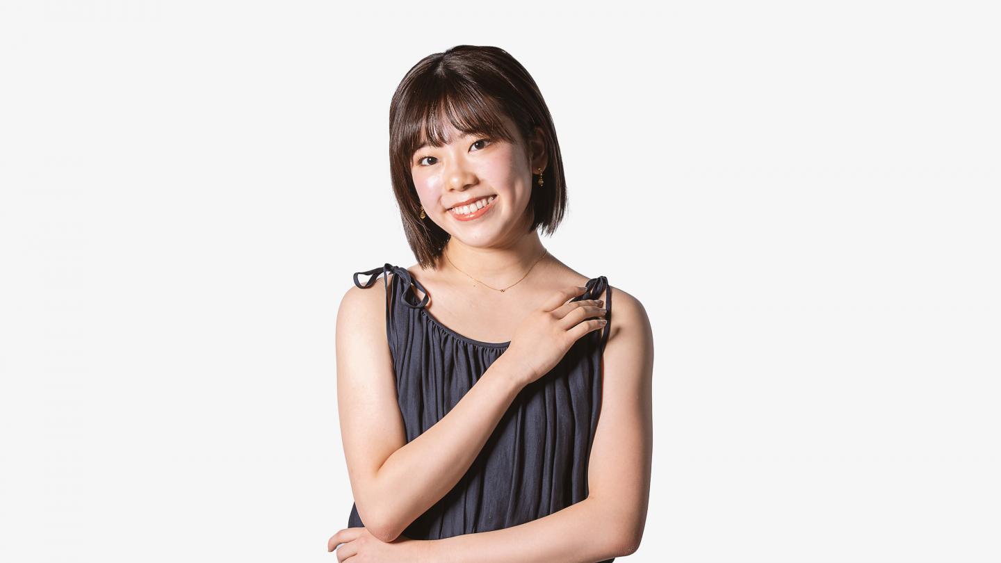 Headshot of a female dancer in a grey top