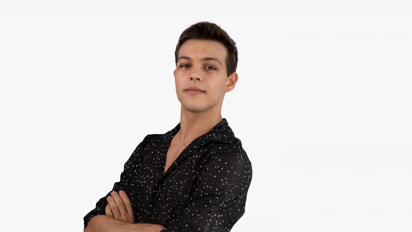 Headshot of a male dancer in a black shirt