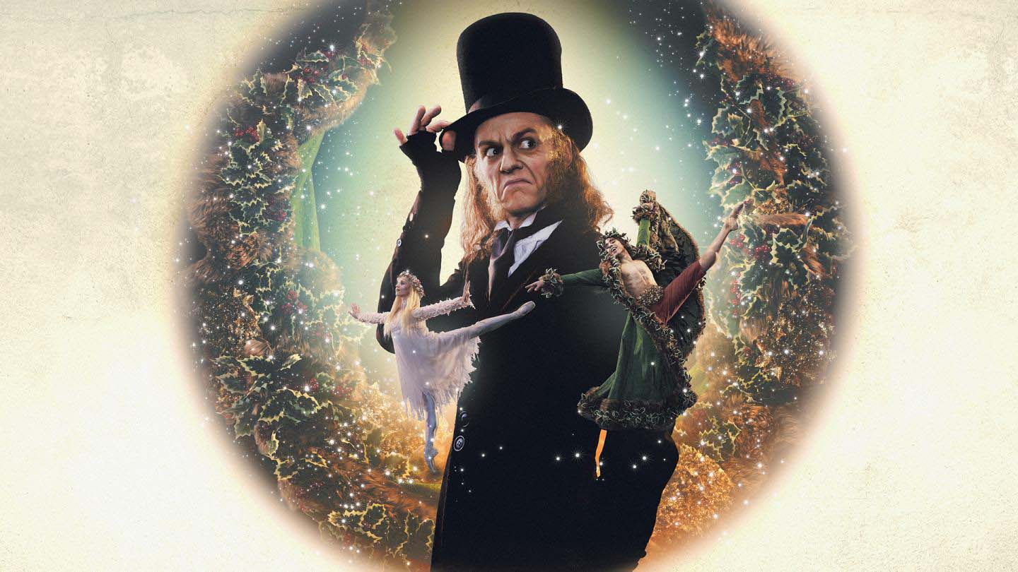 Poster image of A Christmas Carol with Scrooge in his top hat looking mean and in front of him the ghosts of Christmas past and present.