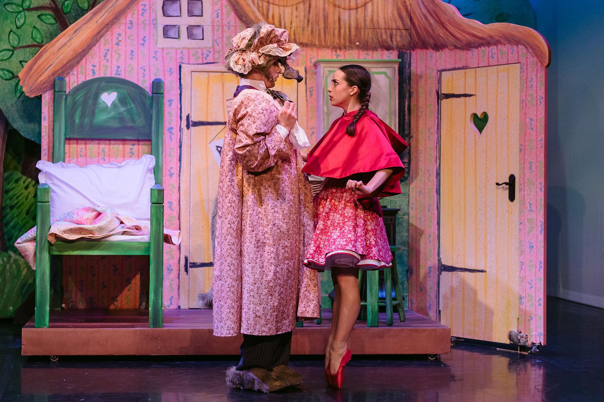 Little Red Riding Hood, production, 2019, Harris Beattie and Julie Nunès as Wolf, Photo Drew Forsyth Little Red begins to see through Wolf's cunning disguise