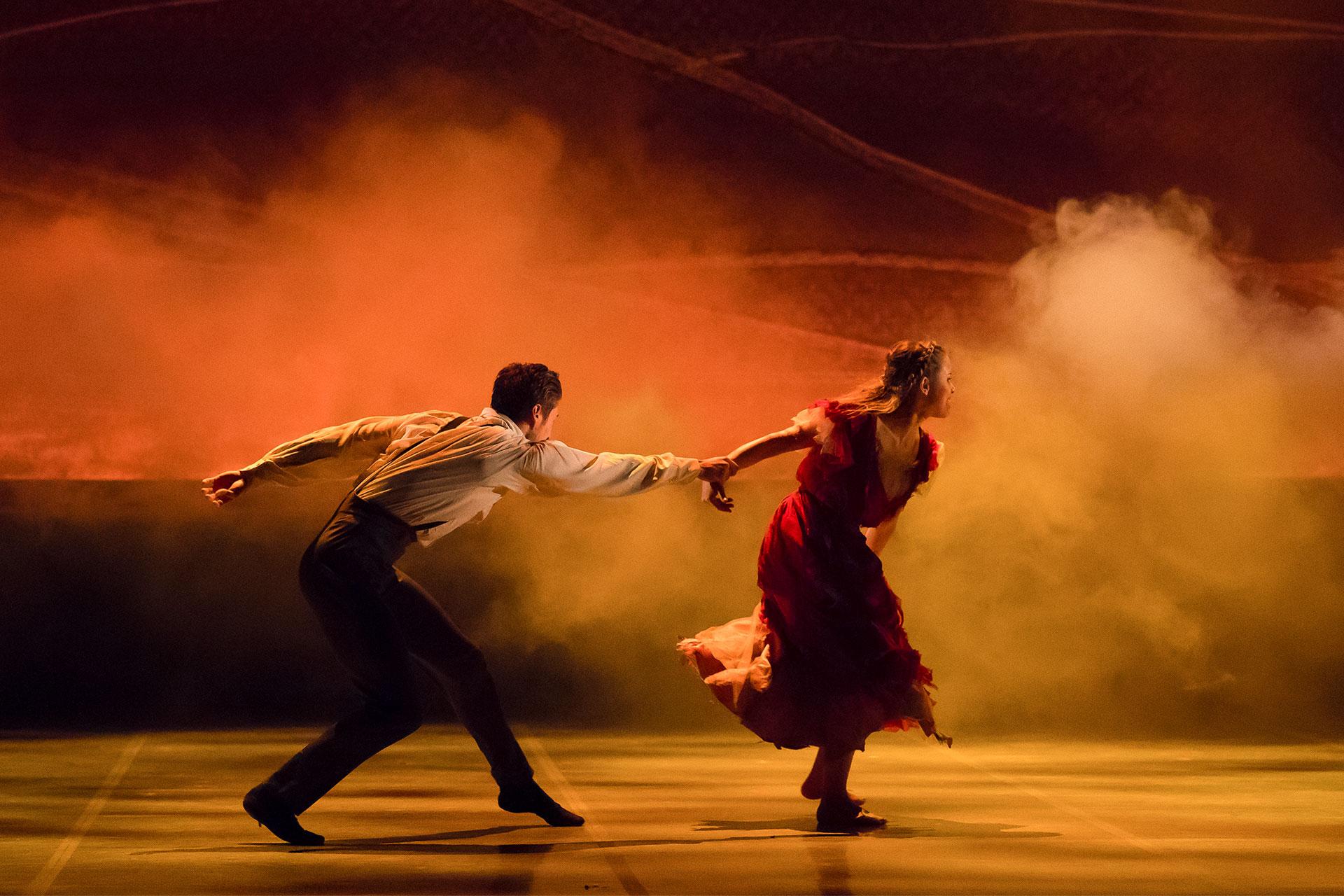 Rochester tries to hold her back, but Bertha is determined to run in to the fire