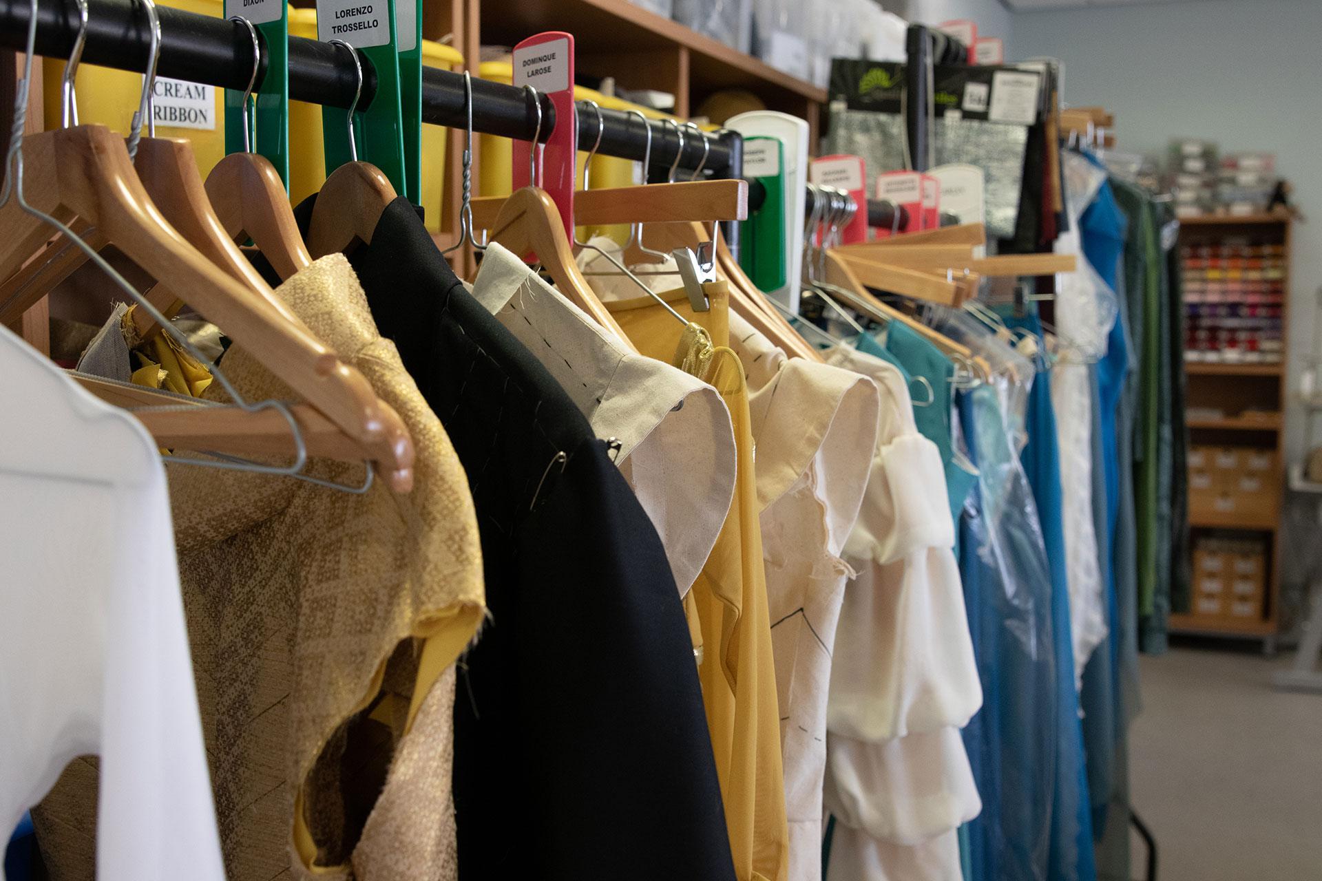 A mixed selection of costumes from Merlin on the rack, some unfinished