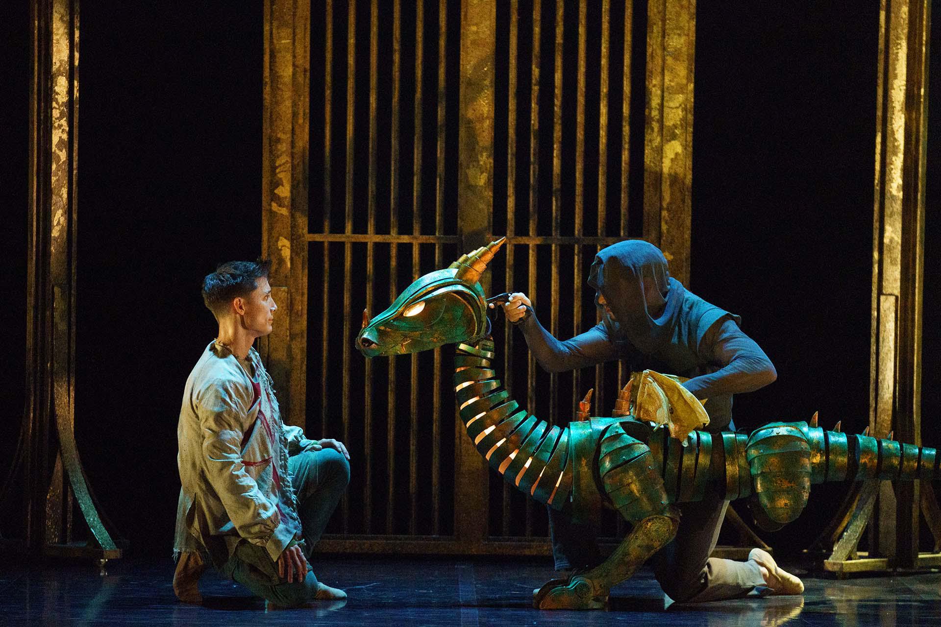 The dragon looks at Merlin, assessing him