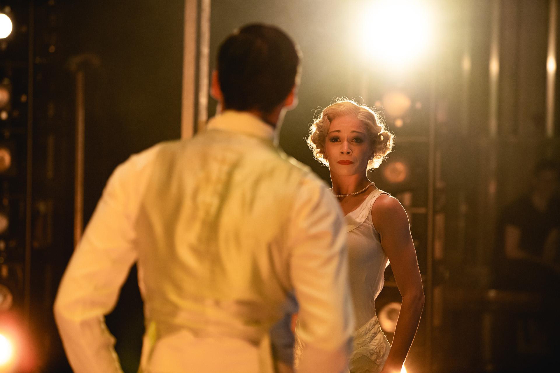 A view from the wings looking over Jay Gatsby's shoulder at Daisy.