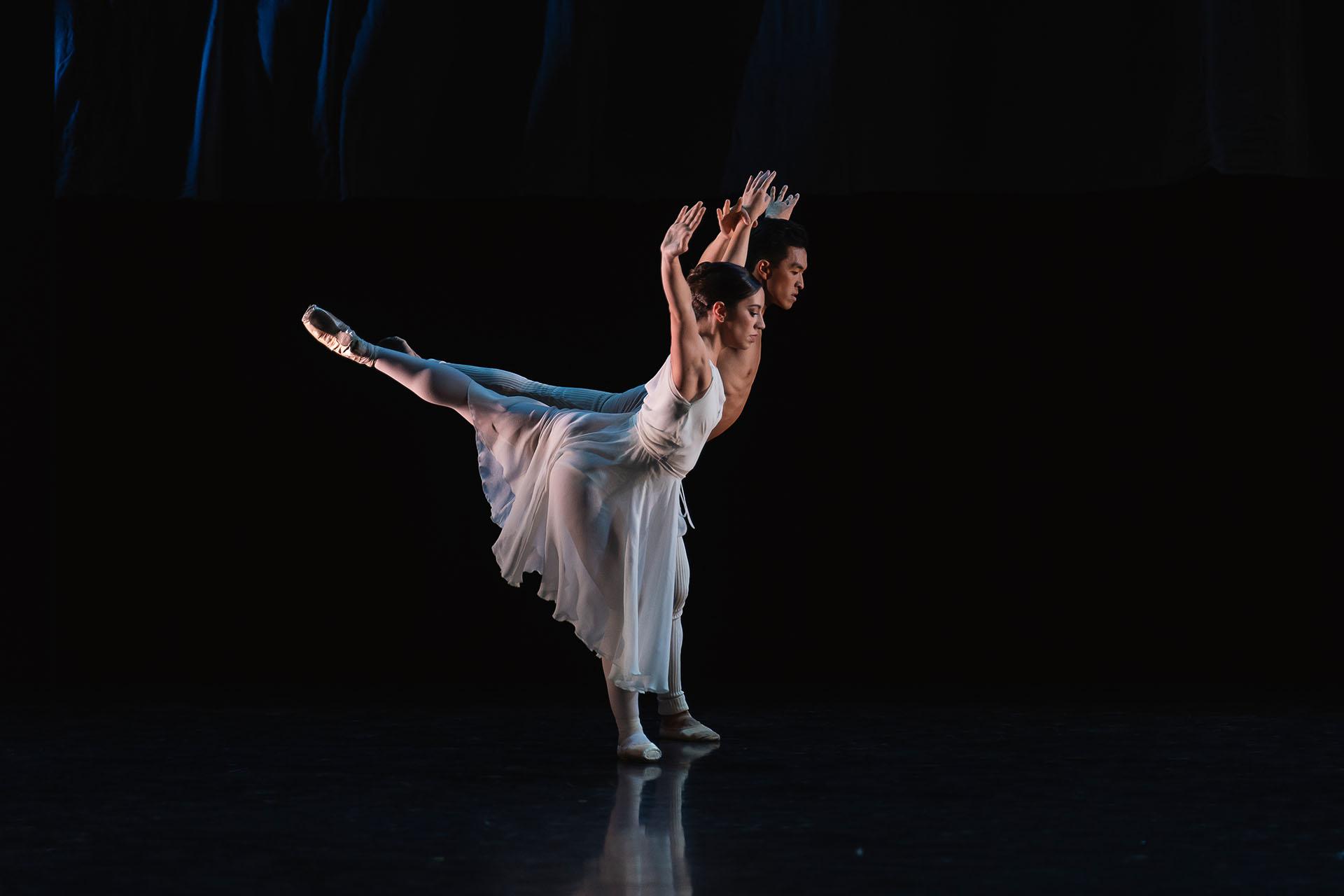 Generations, 2023, production, Alessandra Bramante and George Liang in Adagio Hammerklavier. Photos Emily Nuttall Male and female dancer in white perform synchronous arabesque