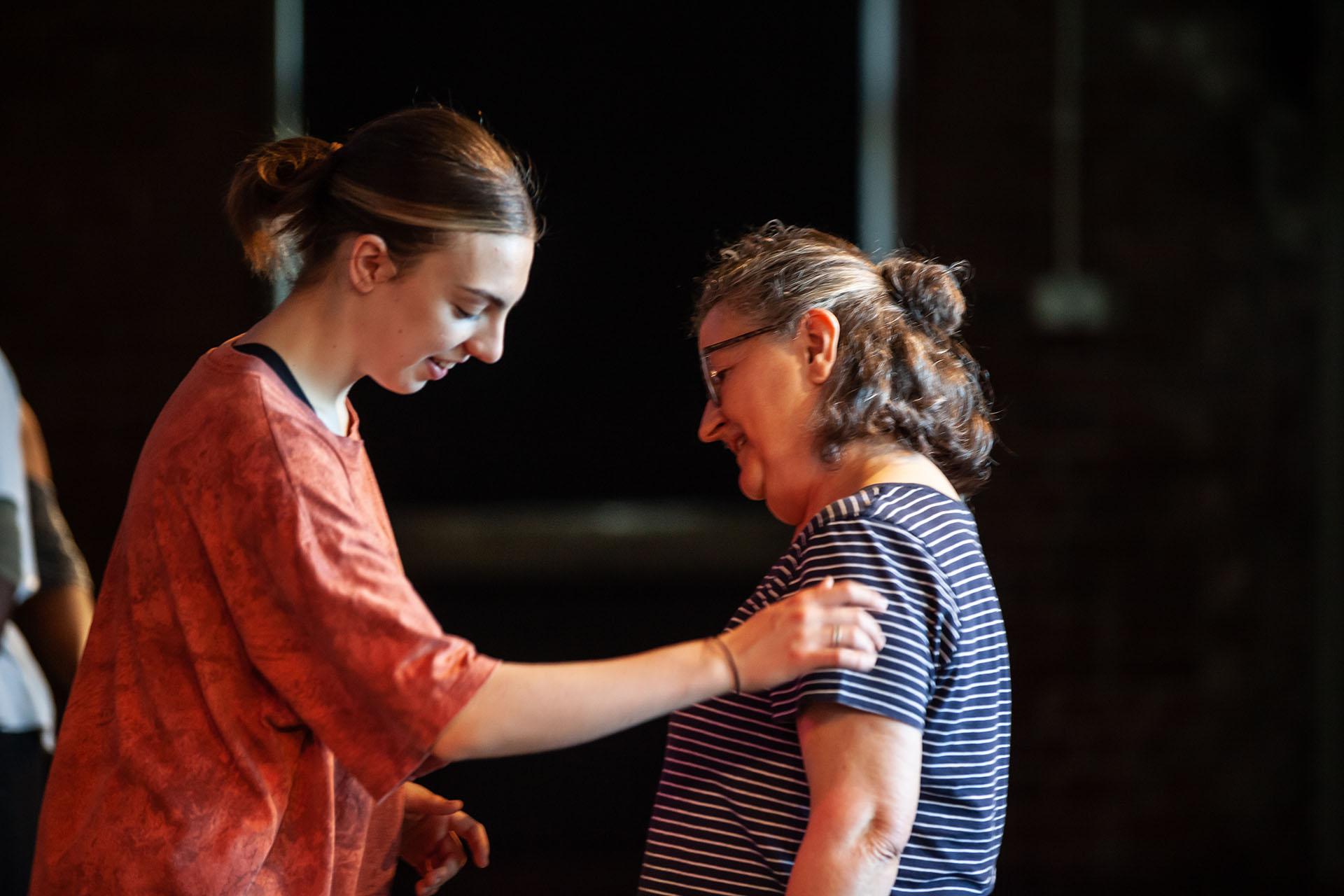 Learning, Expressions, Unbound Dance Theatre by Simon K. Allen Woman with her eyes closed speaking with another, whose arm is guiding the former as they move to the correct position