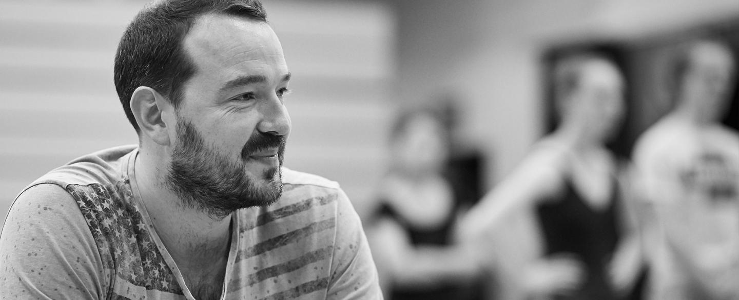 Choreographer Kenneth Tindall watches on as dancers rehearse his creation. Photo Justin Slee.