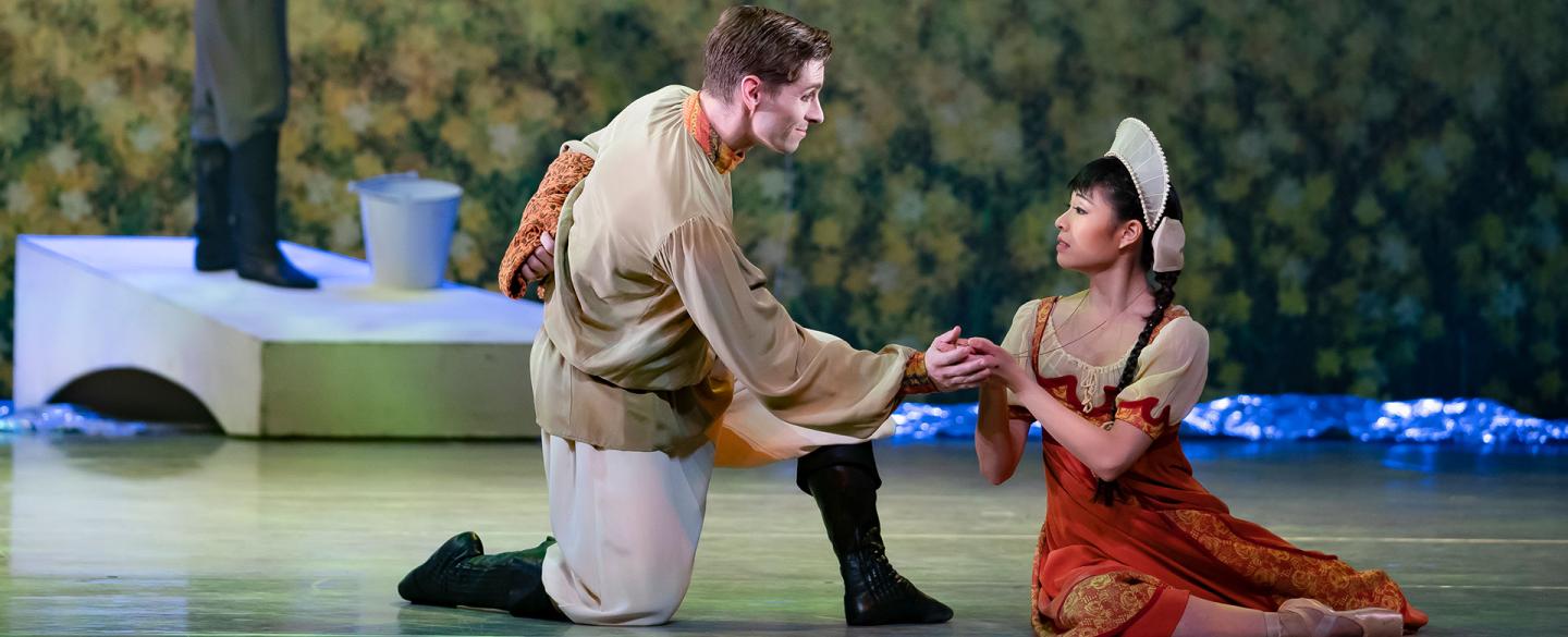 Ashley Dixon's Father holds the hand of Miki Akuta's Young Cinderella to lift her out of her sadness. Photo Emma Kauldhar.