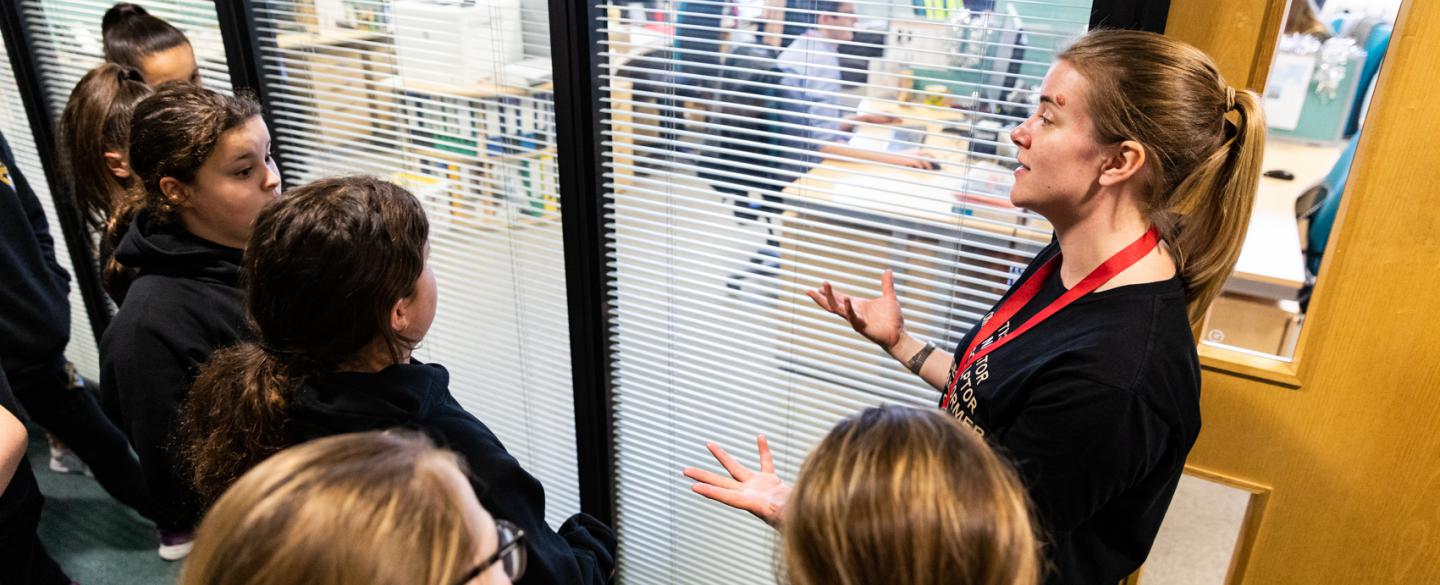 A group of students on a tour of Northern Ballet's offices, led by a Dance Education Officer.