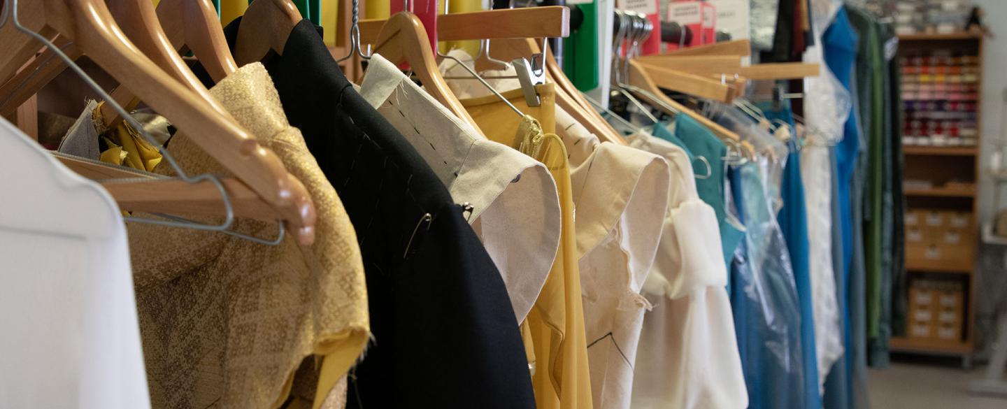 A mixed selection of costumes from Merlin on the rack, some unfinished