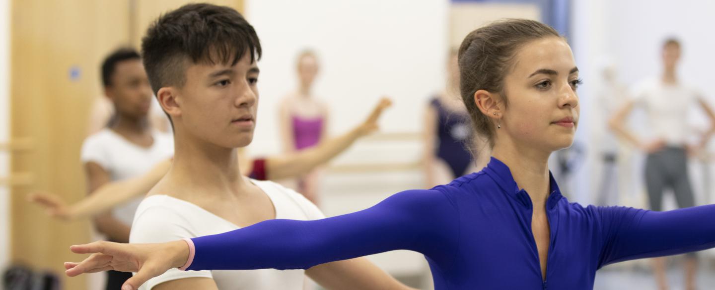 Girl and boy dancing in a Summer Intensive Class. 