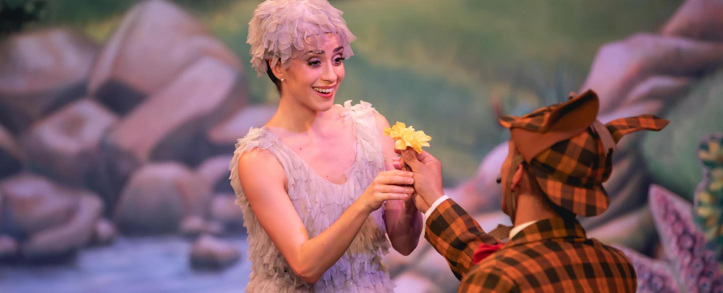 A dancer being given a flower 