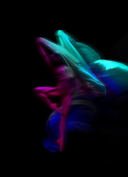 Stylized image of a dancer against a black background lit in magenta and cyan, slightly blurred with motion