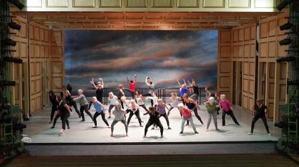 People dancing on a stage as part of a workshop