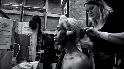 Wigs manager Harriet Rogers fixed Mlindi Kulashe's wig in place before a performance of Casanova. Photo Simon Lee.