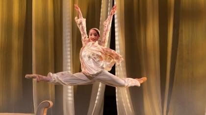 Heather Lehan as Jordan leaping across the stage in The Great Gatsby. Photo Emma Kauldhar