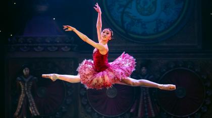 The Sugarplum Fairy leaps forward in an impressive grand Jeté