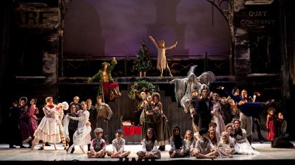 The full cast of A Christmas Carol gather on stage in the finalé