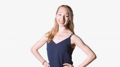 Headshot of a female dancer in a navy top