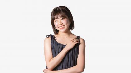 Headshot of a female dancer in a grey top