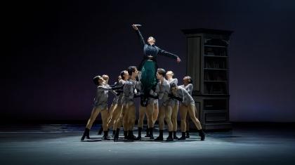 Anne Lister lifted by her words (represented by eleven dancers) and in turn raising a quill