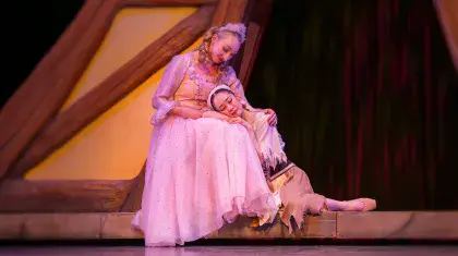 Cinderella with her head resting in her mother's lap